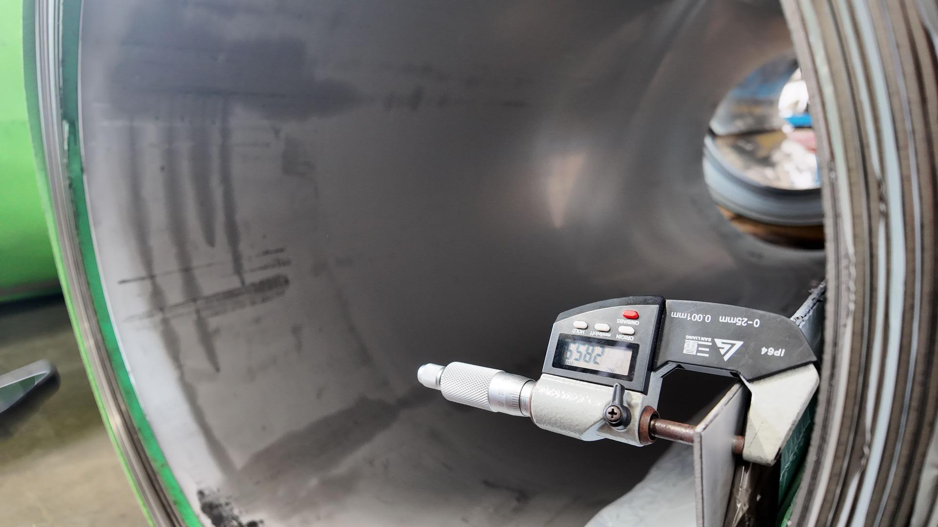 Quality control inspecting stainless steel sheet thickness on the line