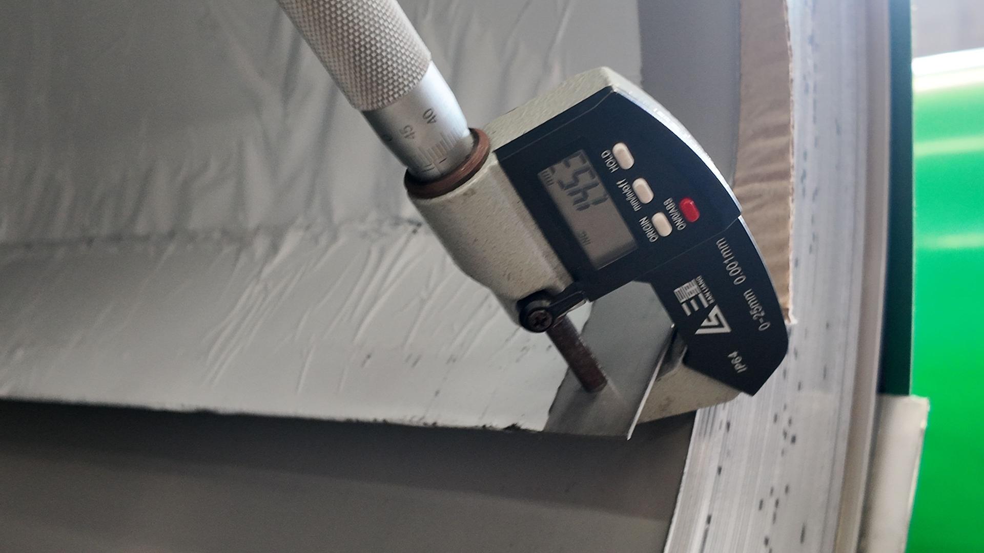 Measuring stainless steel sheet thickness with a digital gauge